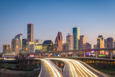 Houston skyline at dusk as seen from I-45 North just past the fork from I-10.