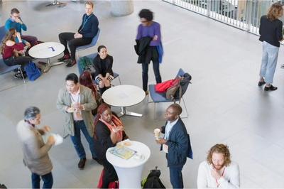 People huddled in groups for networking