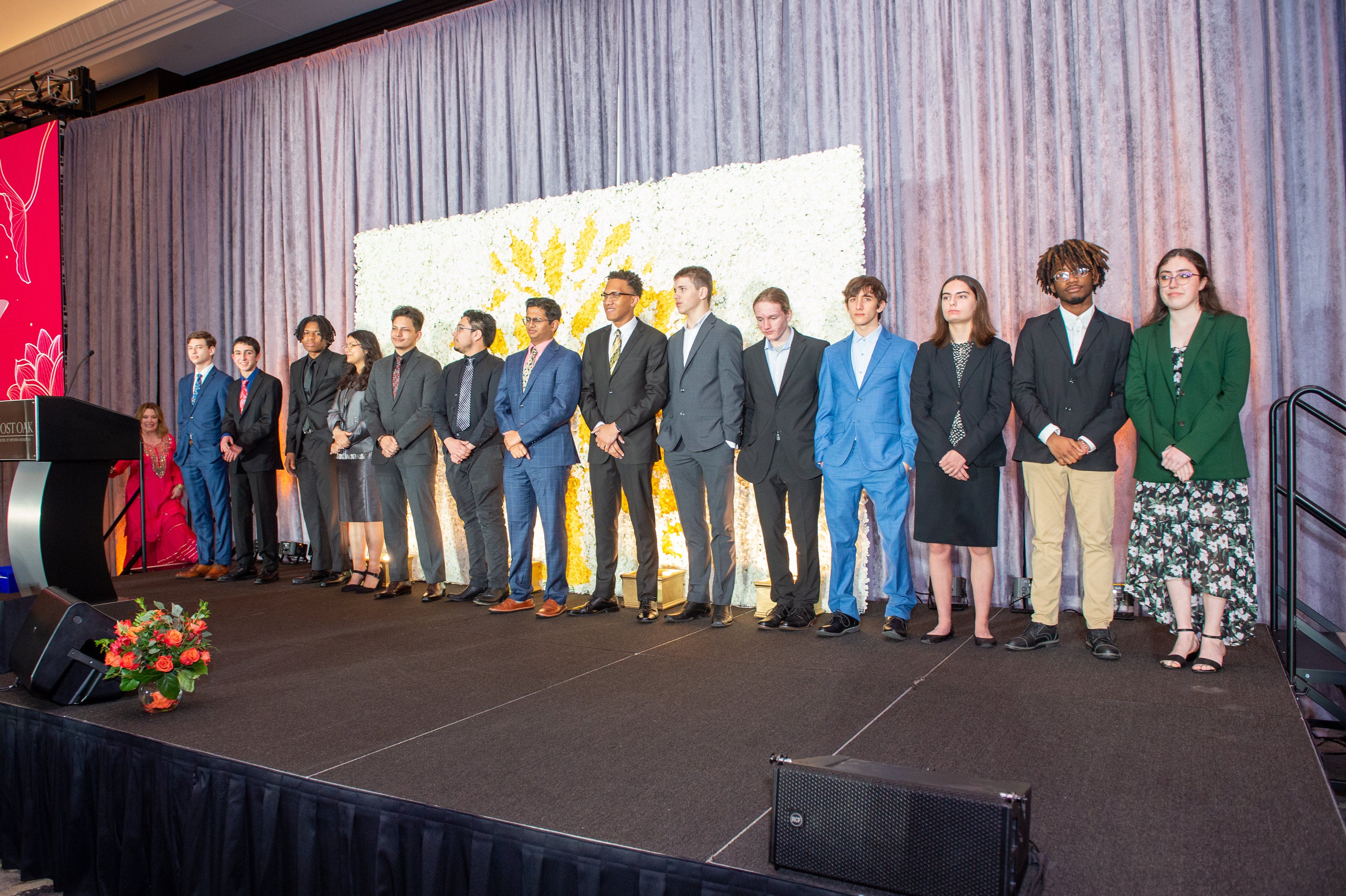 Houston students stand on stage for sustainability awards